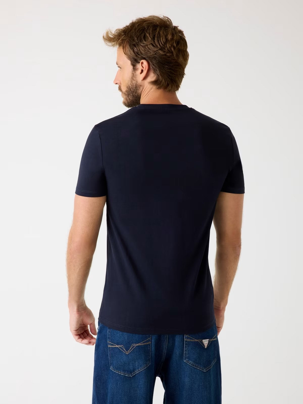 GUESS T-shirt bianca con logo triangolare GUESS